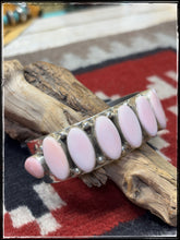 Load image into Gallery viewer, Pansy Johnson, Navajo silversmith.  Sterling silver and pink conch row cuff. 
