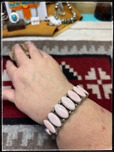 Load image into Gallery viewer, Pansy Johnson, Navajo silversmith.  Sterling silver and pink conch row cuff. 
