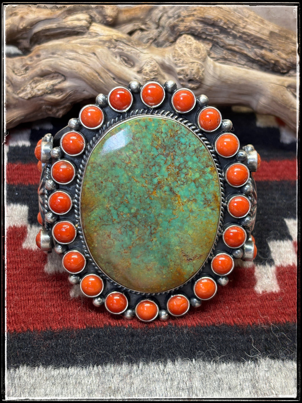 Kevin Billah, Navajo silversmith. Sterling silver, coral and turquoise mega cuff.