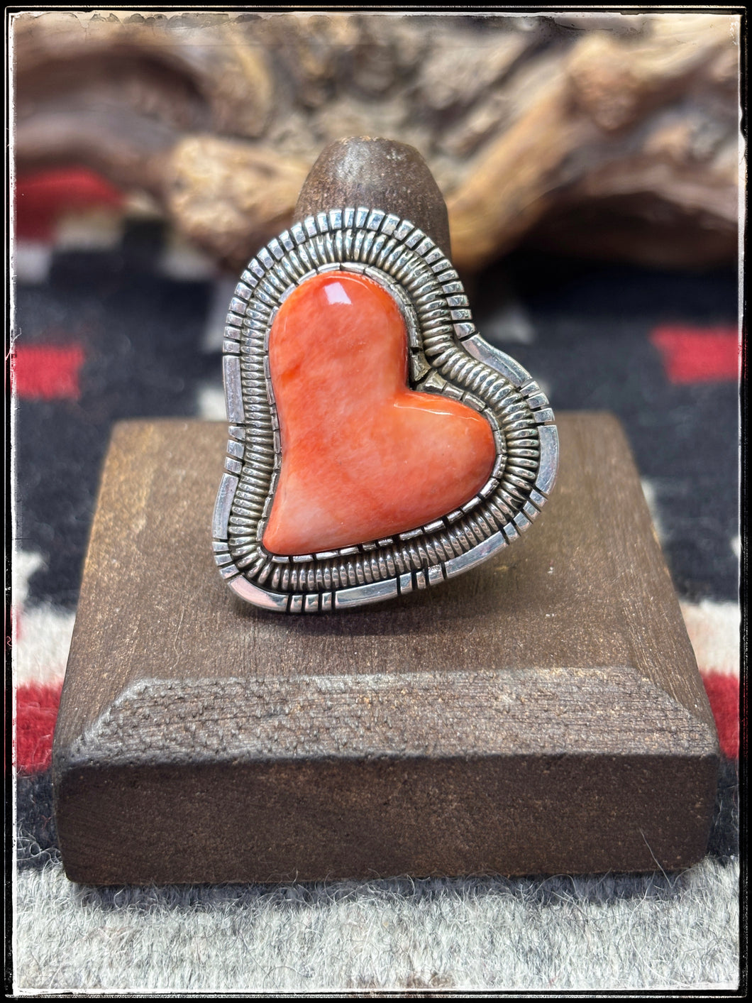 Walter Vandaveer, Navajo silversmith.  Sterling silver and 0range spiny oyster shell heart shaped ring with an adjustable band. 