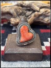 Load image into Gallery viewer, Walter Vandaveer, Navajo silversmith.  Sterling silver and 0range spiny oyster shell heart shaped ring with an adjustable band. 
