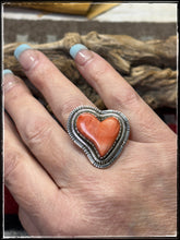 Load image into Gallery viewer, Walter Vandaveer, Navajo silversmith.  Sterling silver and 0range spiny oyster shell heart shaped ring with an adjustable band. 
