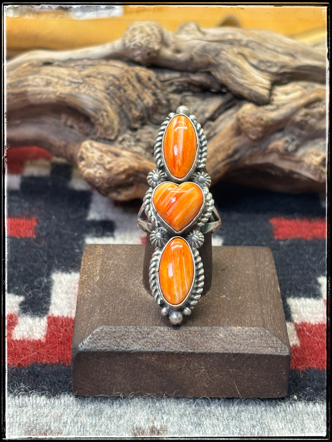 Robert Shakey, Navajo silversmith.  Orange spiny oyster shell and sterling silver elongated ring  