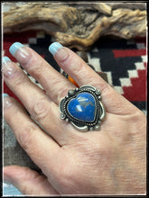 Load image into Gallery viewer, Ronald Tom, Navajo silversmith. Sterling silver and denim lapis heart shape stones. Rings have an adjustable band with stampwork. 
