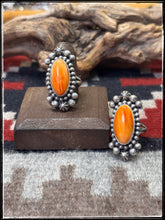 Load image into Gallery viewer, Blaine Yellowhorse, Navajo silversmith.  Sterling silver and orange spiny shell rings. 
