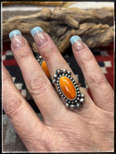 Load image into Gallery viewer, Blaine Yellowhorse, Navajo silversmith.  Sterling silver and orange spiny shell rings. 
