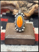 Load image into Gallery viewer, Blaine Yellowhorse, Navajo silversmith.  Sterling silver and orange spiny shell rings. 
