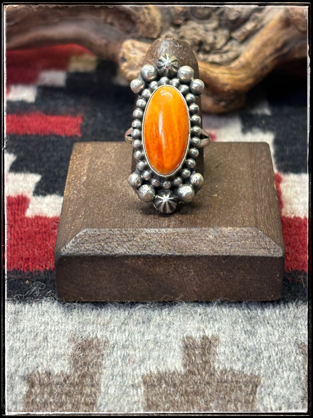 Blaine Yellowhorse, Navajo silversmith.  Sterling silver and orange spiny shell rings. 