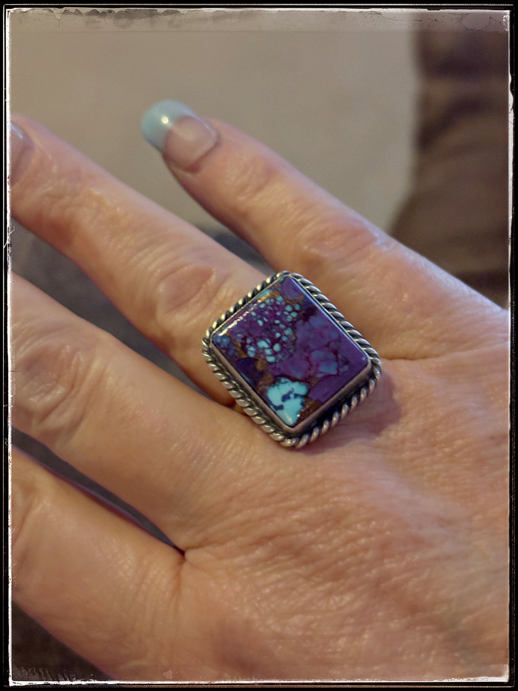 Donovan Skeets, Navajo silversmith.  Sterling silver and purple mojave composite stones with an adjustable ring band. 