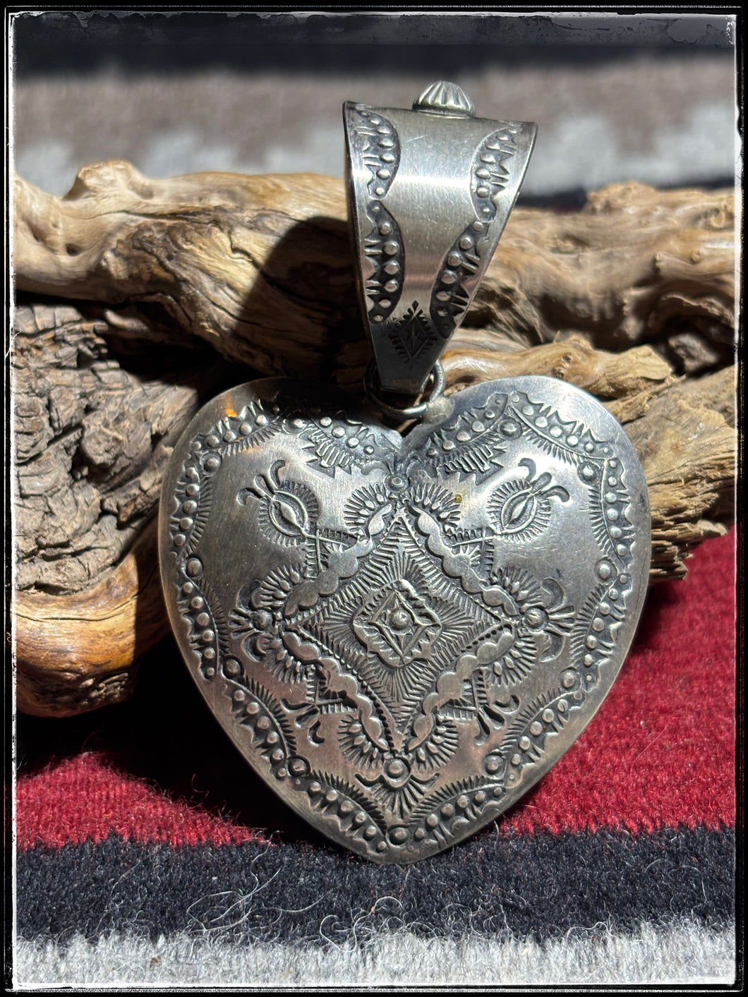 Vincent Platero Navajo silversmith.  Sterling silver xl pendant heart. 