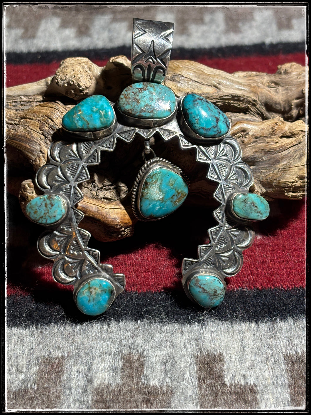 Sterling silver and turquoise pendant from Navajo silversmith Sean Cayatineto. 