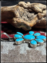 Load image into Gallery viewer, Sterling silver and turquoise cluster style pendant from Navajo silversmith Travis Jim. 
