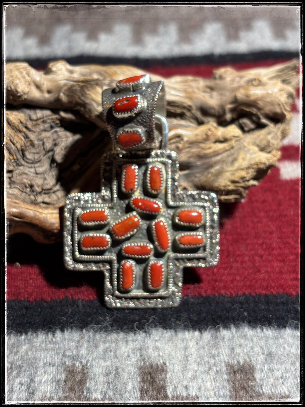 Del Arviso, Navajo silversmith.  Sterling silver and coral pendant. 