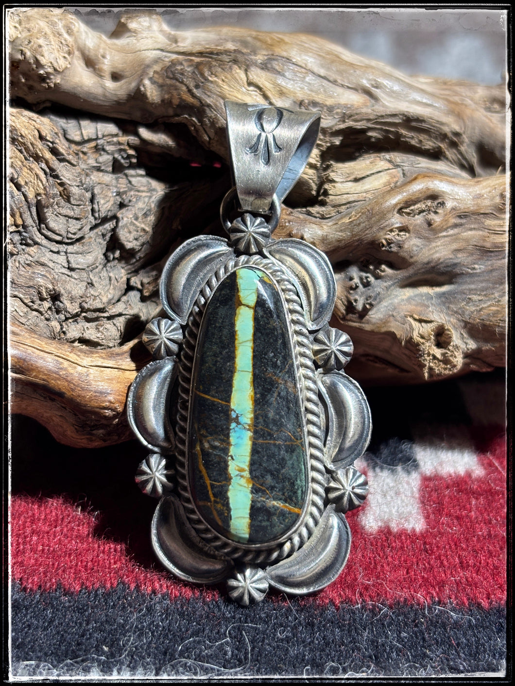 Ray Delgarito, Navajo silversmith.  Sterling silver and Blackjack turquoise pendant.  