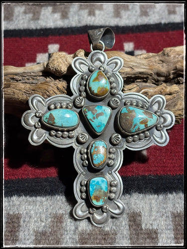 Dean Sandoval, Navajo silversmith.  Sterling silver and turquoise cross pendant.  