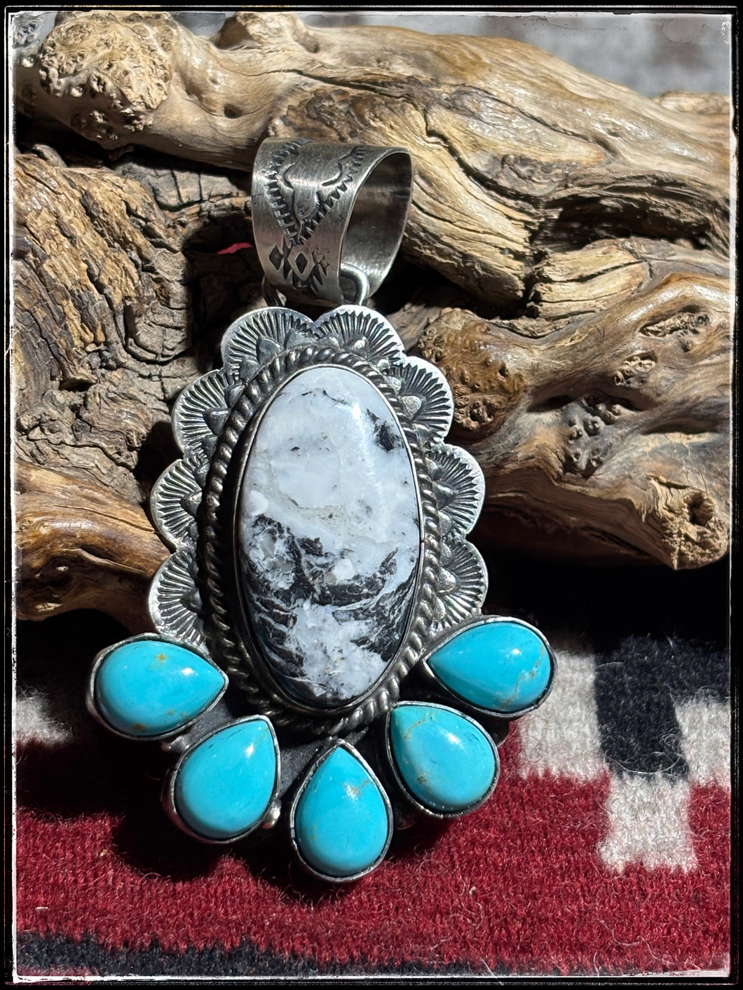 Kee Johnson, Navajo silversmith.  Sterling silver, White Buffalo, and kingman turquoise pendants.  A