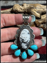 Load image into Gallery viewer, Kee Johnson, Navajo silversmith.  Sterling silver, White Buffalo, and kingman turquoise pendants. 
