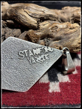 Load image into Gallery viewer, Stanford Yazzie, Navajo silversmith. Sterling silver tufa cast pendant.  Hallmark stamp. 
