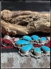 Load image into Gallery viewer, Sterling silver and Kingman turquoise Naja pendant from Navajo silversmith Kee Johnson. 
