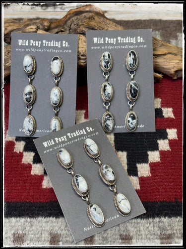 Freda Martinez, Navajo silversmith.  Sterling silver and White Buffalo triple drop earrings. 