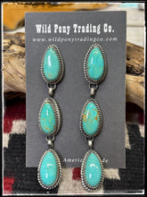 Load image into Gallery viewer, Freda Martinez, Navajo silversmith. Sterling silver and Kingman turquoise triple teardrop earrings. 
