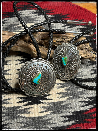Sterling silver and Sonoran Gold turquoise bolo ties with black, braided, leather cords and sterling silver tips.