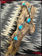 Load image into Gallery viewer, Judith Dixon, Navajo silversmith.  7 Stone link bracelet with Kingman turquoise.   Soft speckled blue 
