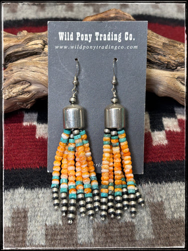Sterling silver, turquoise beads, and orange spiny shell beads in a 6 strand tassel earring.