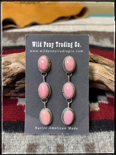 Freda Martinez, Navajo silversmith.  Sterling silver and pink conch shell triple drop earrings.  