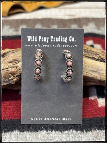 Sterling silver and pink conch shell hop earrings, handmade by Zuni artists.
