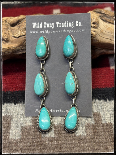 Sterling silver and Kingman turquoise earrings from Navajo silversmith Freda Martinez. 