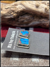 Load image into Gallery viewer, Judith Dixon, Navajo silversmith.  Sterling silver and Mojave turquoise (a composite) stud earrings. 
