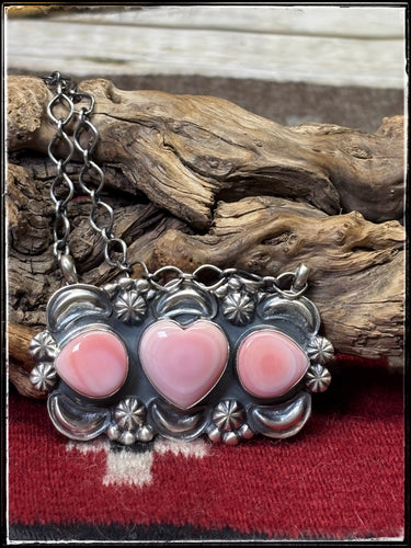 Jeff James Jr., Navajo silversmith.  Sterling silver and pink conch shells, intricately detailed in sterling silver. 
