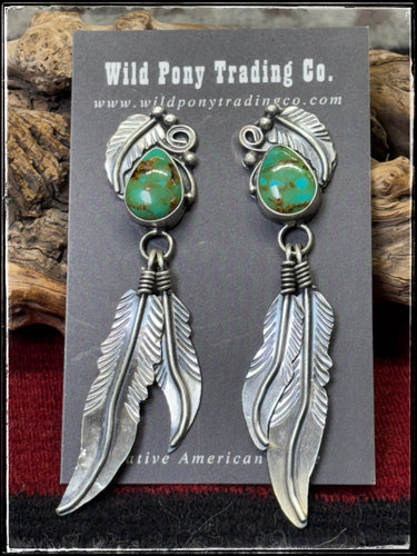 Kobe Martinez, Navajo silversmith.  Sterling silver and Kingman turquoise earrings with double feather dangles. 