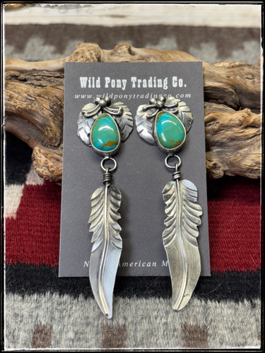 Kobe Martinez, Navajo silversmith.  Sterling silver and Kingman turquoise earrings with feather dangles. 