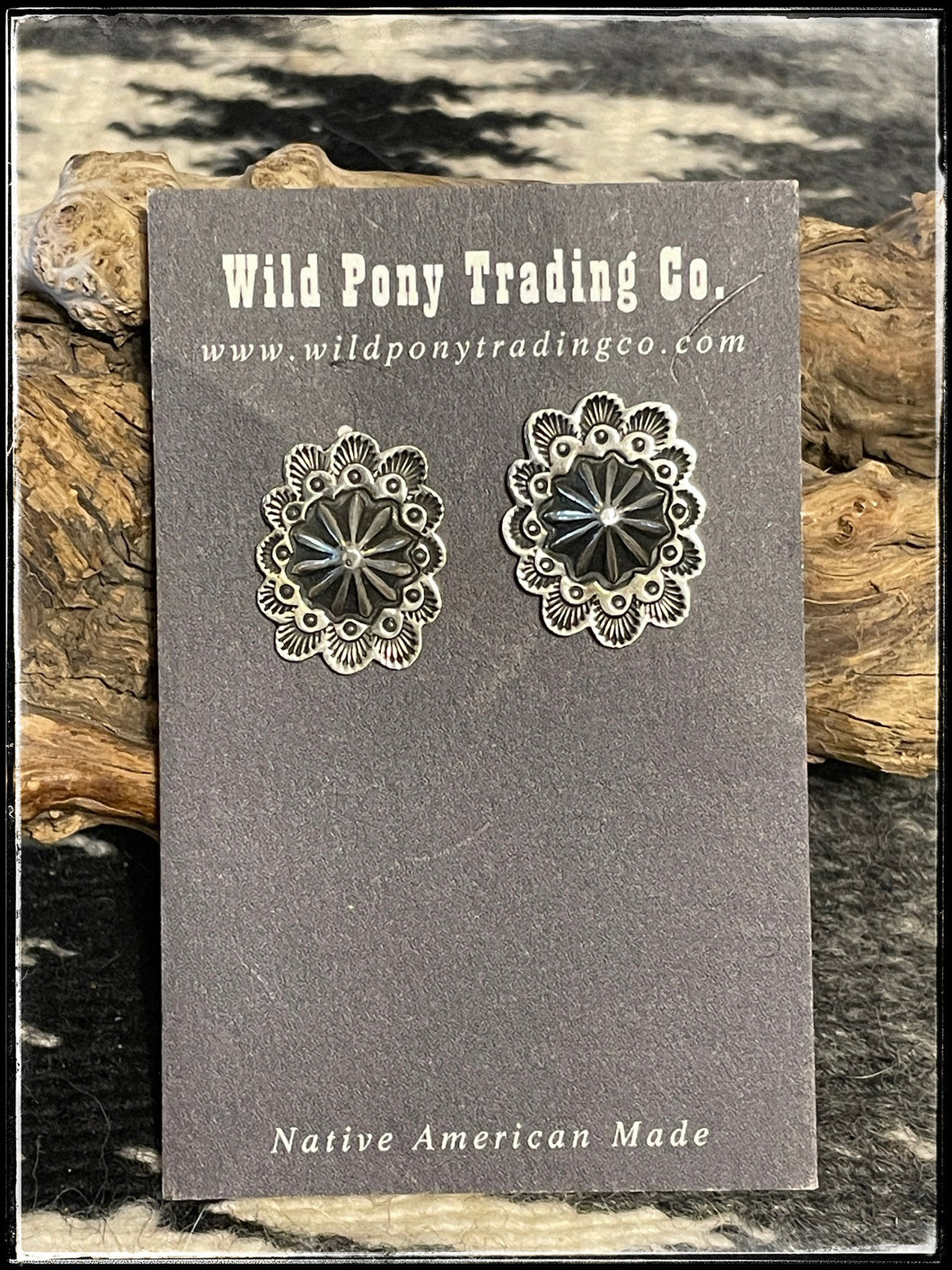 Roland Dixon, sterling silver, concho style earrings. Navajo made.