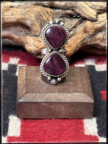 Eugene Belone, Navajo silversmith.  Sterling silver and deep purple spiny shell. Adjustable band.. 