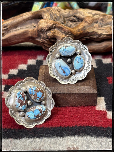 Bobby Johnson, Navajo silversmith.  Sterling silver and Golden Hills turquoise concho rings. 