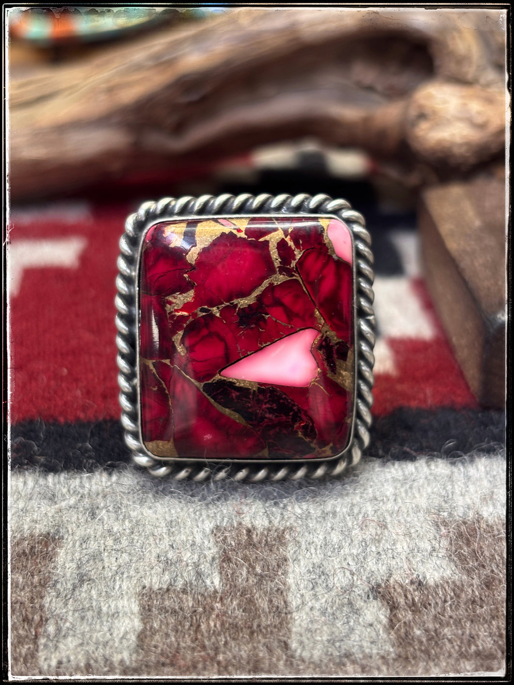 Augustine Largo, Navajo silversmith. Sterling silver and Rose Dahlia square rings. 