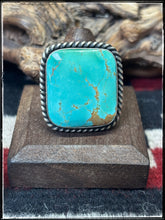 Load image into Gallery viewer, Augustine Largo, Navajo silversmith.  Sterling silver and Kingman turquoise square rings with an adjustable band.  
