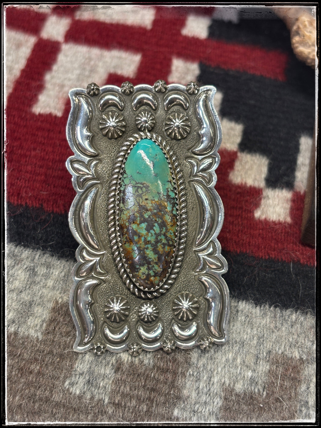 Shannon Tahe, Navajo silversmith.  Sterling silver and turquoise, elongated shield style bar rings  Ring A. 