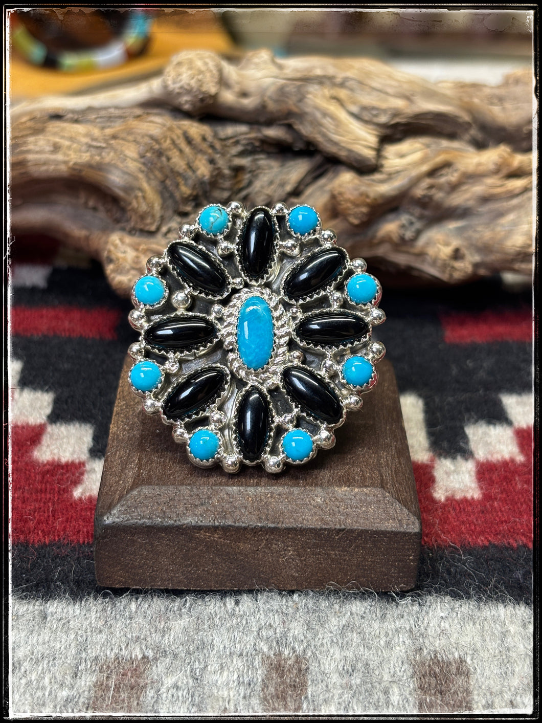 Sterling silver, blue turquoise, and black onyx cluster ring.  Adjustable band, Navajo handmade.  Hallmarked BJ 
