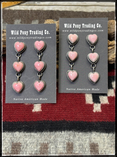Freda Martinez, Navajo silversmith. Sterling silver and pink conch heart earrings.  