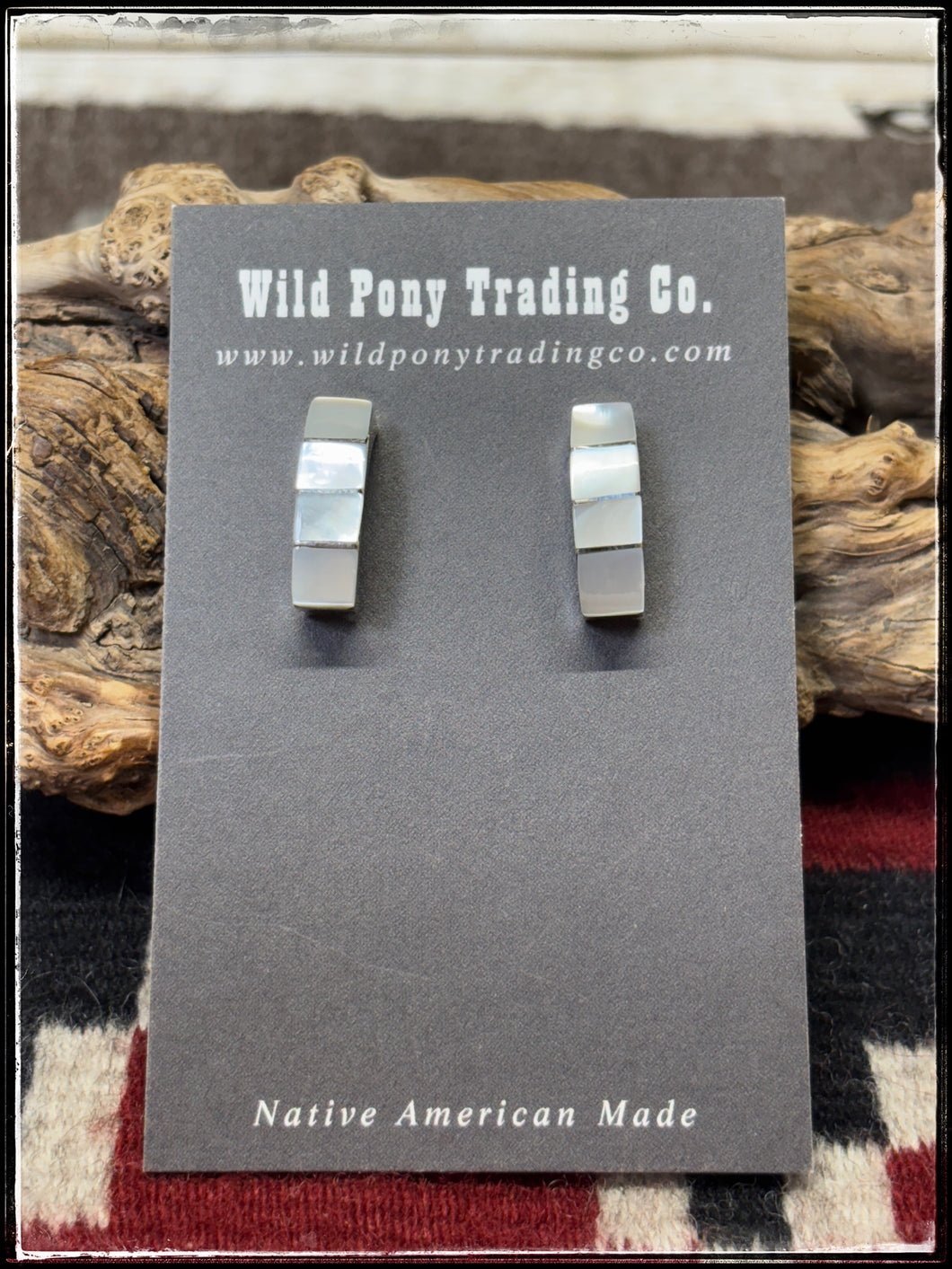 Gilbert Kanestra, Zuni artist.  Sterling silver and shell half hoops.  
