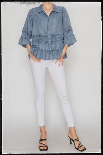 Denim chambray top with 3/4 sleeves and ruffles. 
