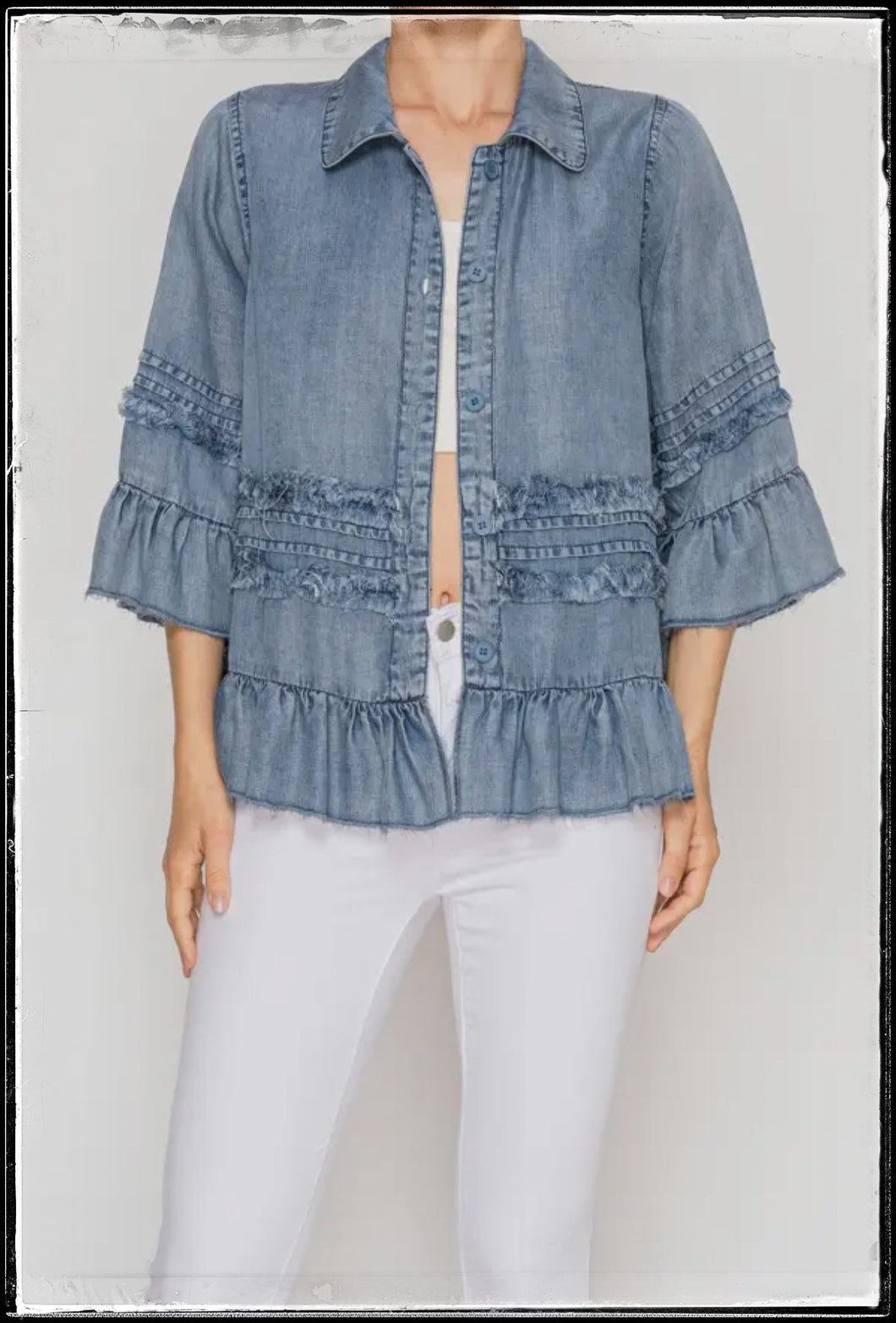 Denim chambray top with 3/4 sleeves and ruffles. 