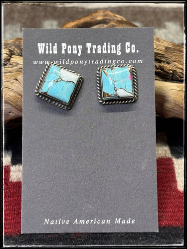 Judith Dixon, Navajo silversmith. Sterling silver and cotton candy composite studs. 