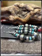 Load image into Gallery viewer, Sterling silver bench made beads along with machine blown beads and turquoise disc earrings. 
