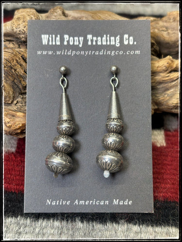 Sterling silver, machine blown beads with stampwork.  