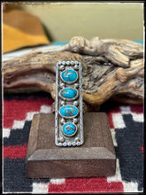 Load image into Gallery viewer, Priscilla Reeder Navajo silversmith. Sterling silver and 4 turquoise stone ar ring. 

